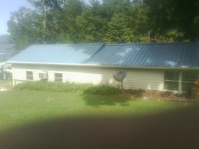 Blue metal roof running the length of a single story home in Frisco